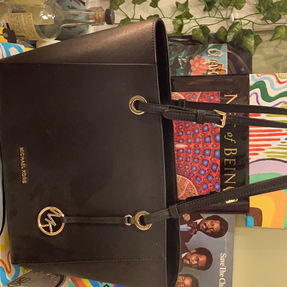 An all black Michael Kors bag